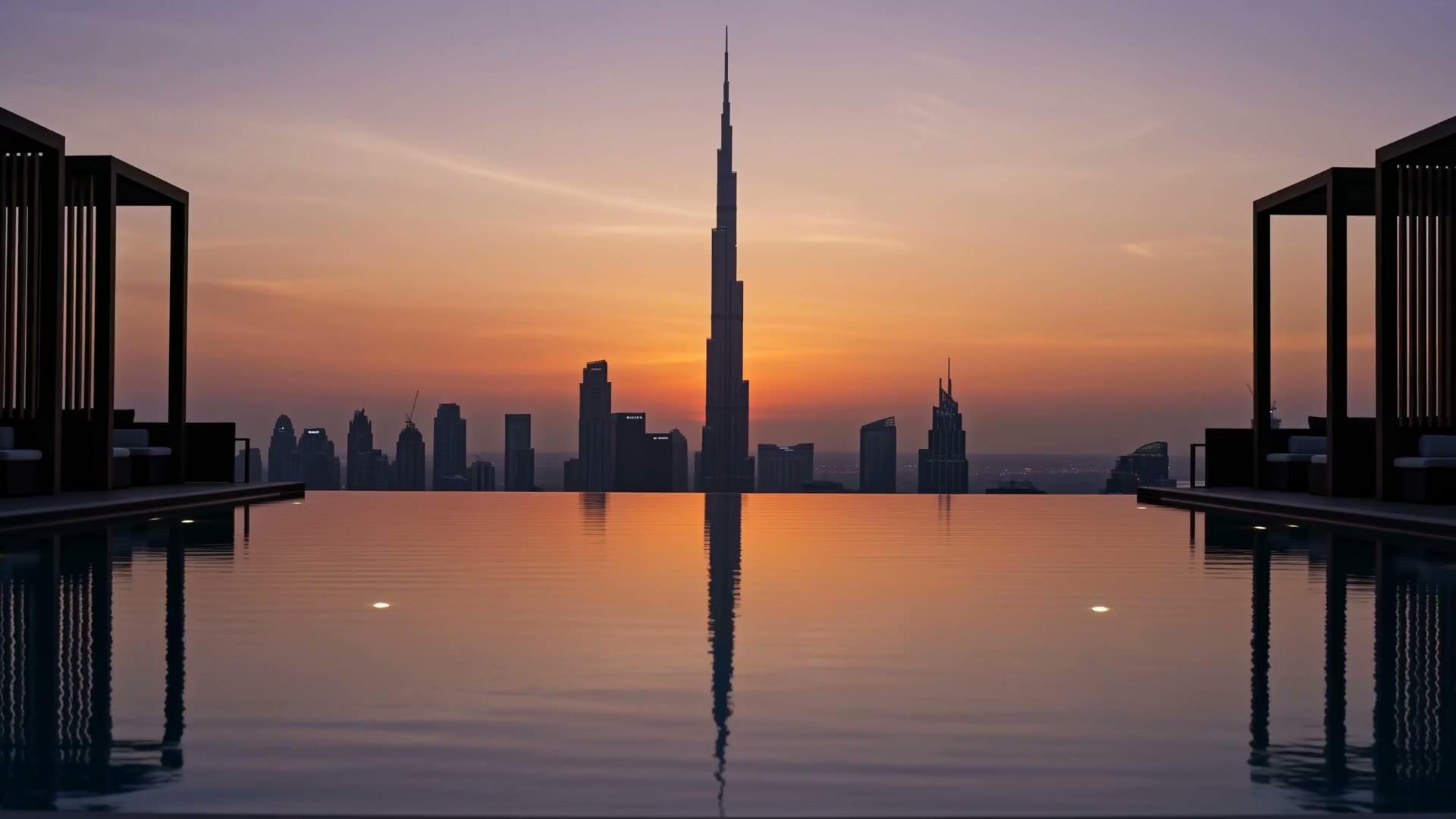 Rooftop infinity pool at sunset above the Dubai skyline